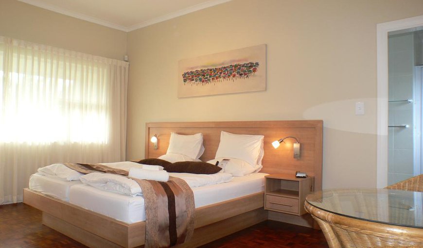 Superior Room: Superior Room - These tastefully decorated African-themed rooms each have their own terrace and are furnished with an extra-length king-size bed and en-suite bathroom with a shower.