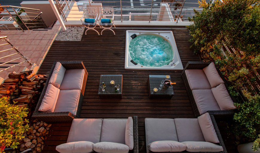 Patio with a hot tub and beautiful views