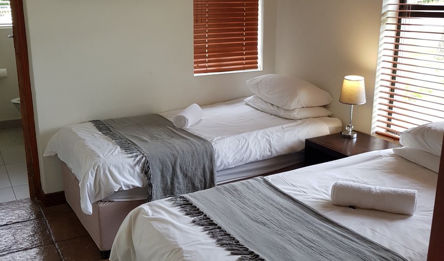 Guest Cottages: Second bedroom featuring two single beds