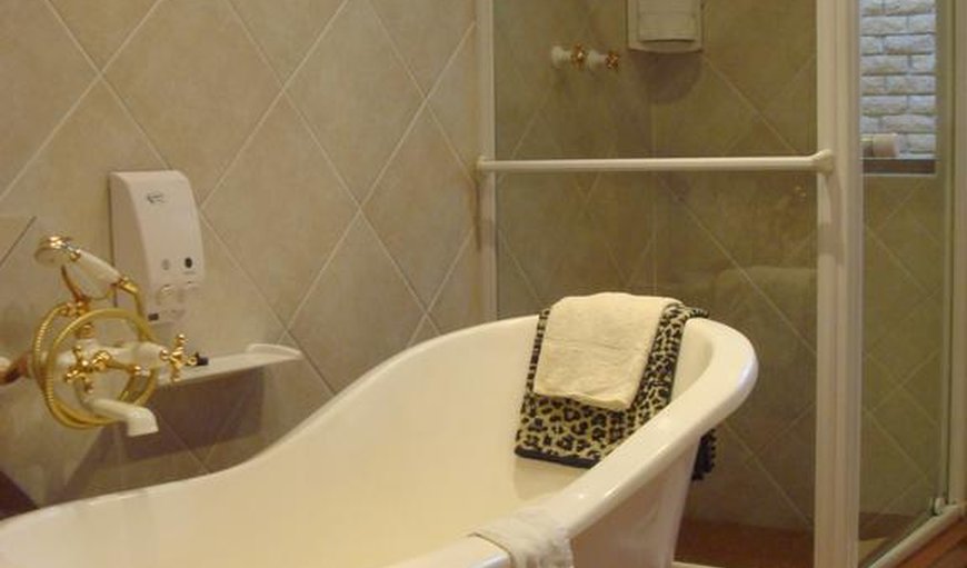 Honeymoon Suite x 1: Bathroom with a bath and shower