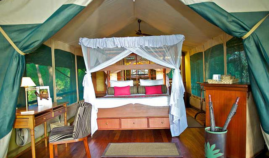 Luxury Tented Camp - The spacious tents offer 4-poster beds that are either a queen size bed or two twin beds and an en-suite bathroom.