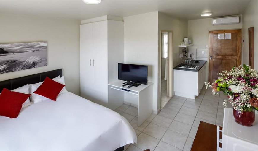 Double Rooms Ground Floor: Each room contains either a double bed or twin single beds, an en-suite bathroom, a TV with DStv, tea and coffee-making facilities and air-conditioning.