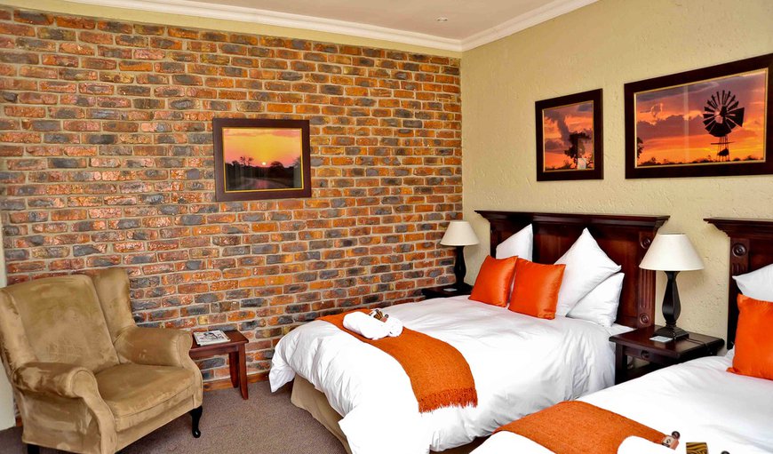Luxury En-Suite Room: Luxury En-Suite Room furnished with two double beds.