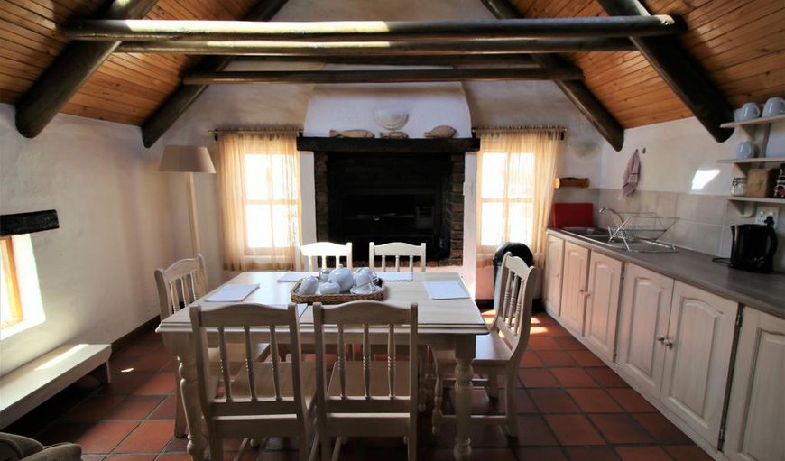 The open plan kitchen is equipped with a fridge, stove, microwave and kettle.