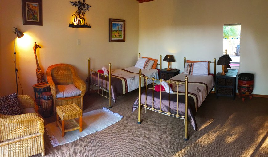 Giraffe Room: Giraffe Room - The room is furnished with 2 single beds that can be converted into a king size bed and has a sleeper couch for a third guest
