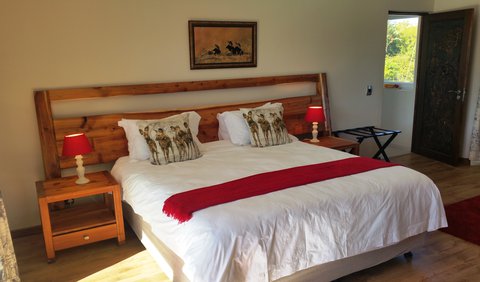 The Rhino Suite: The Rhino Suite is a large suite with a roomy bathroom and a walk-in shower. It has a king size XL bed, convertible into two large twin beds. Furthermore enough space is provided for an additional , single bed (at additional cost).