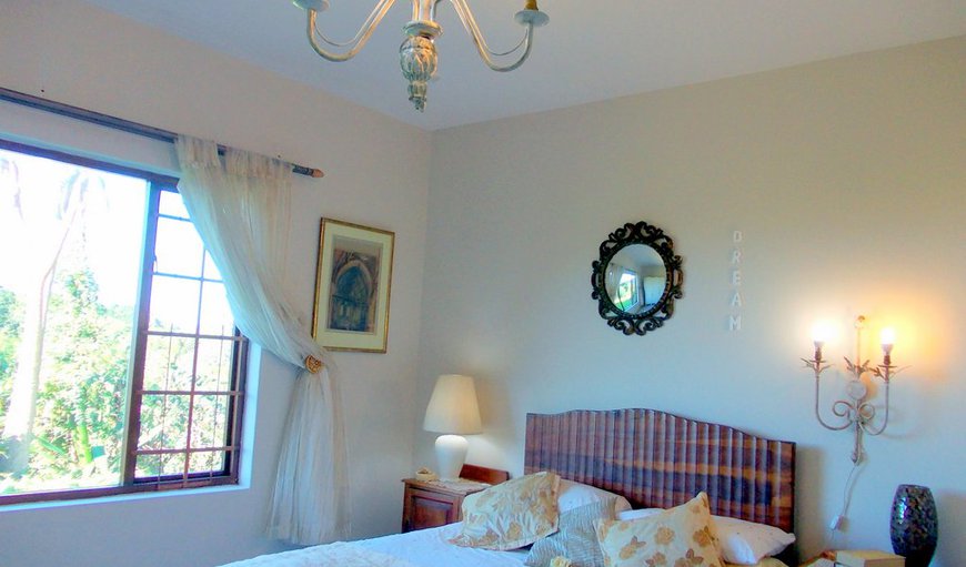 GOLDEN SUNSET - lovely large bedroom has sea view. wardrope dressing table laptop table with overhead antique gold chandelier and wall mounted lights.