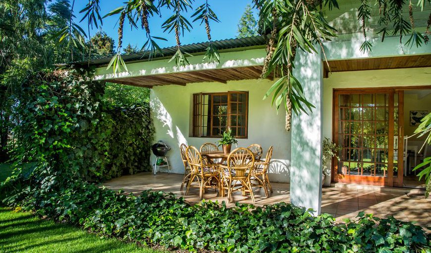 Self-Catering Cottage:: The cottage features a furnished patio with a beautiful garden.