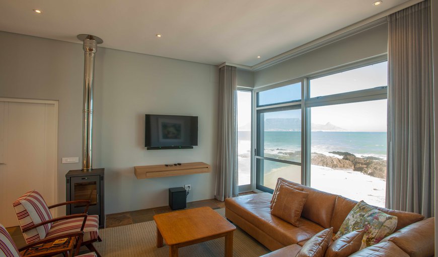 High Tide - Unit: High Tide - The lounge area is furnished with a beautiful corner couch and offers a TV and spectacular views.