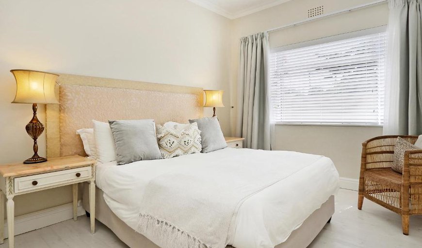 Deluxe Room 7 Queen: Deluxe Room 7: The bedroom has elegant soft beige décor with a herringbone thread carpet.