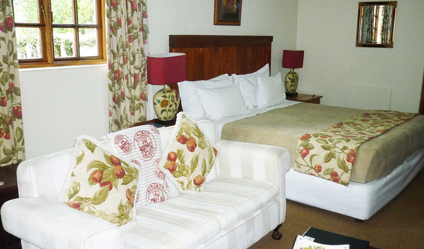 Executive room : Executive Suite bedroom with king or twin single beds and couch to relax.