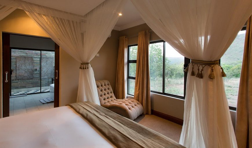 Standard Suite: Bedroom with a queen sized bed