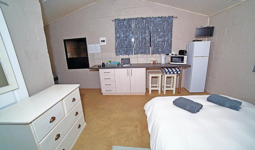 No 4: No 4 with an open living area with a double bed and a kitchenette.