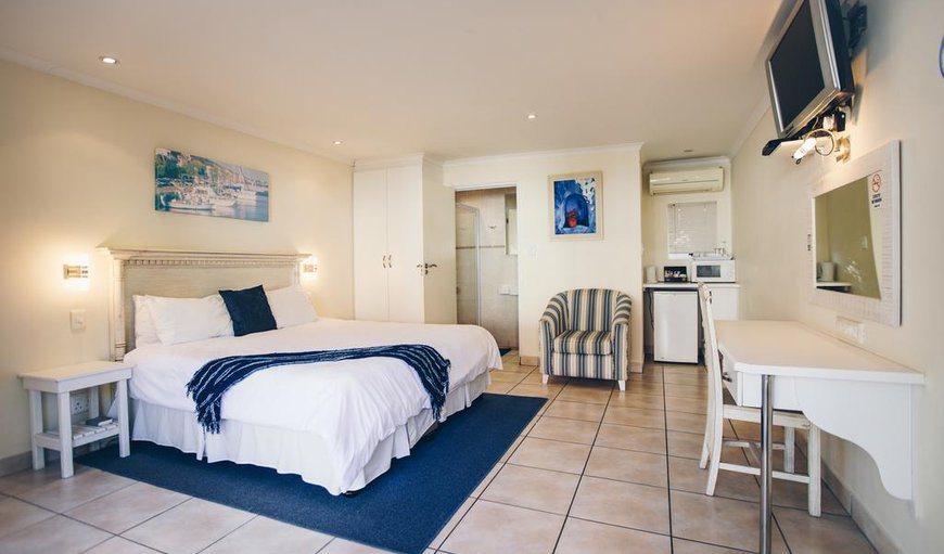 Large Suite: Each room is equipped with LCD TV's with 10 DSTV channels (with added German & Italian Channels), a large comfortable queen sized bed, bar fridge, modern finished bathrooms and original artwork.