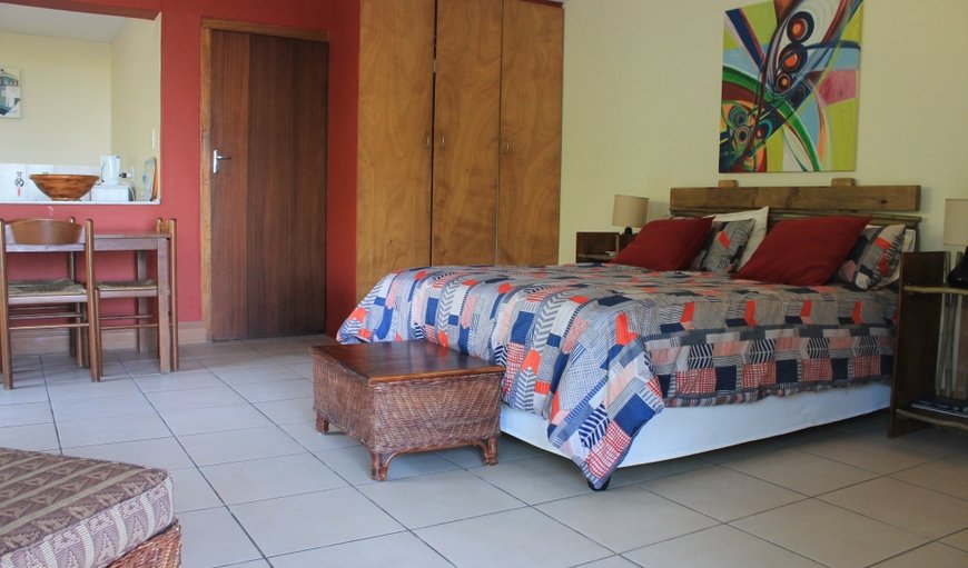 Dolphin View bedroom includes a queen-size double bed and is flanked by the en-suite bathroom, equipped with modern amenities.