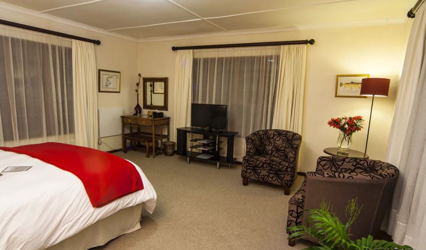 Luxury Queen Suite: Luxury Suite - Bedroom with a queen size bed