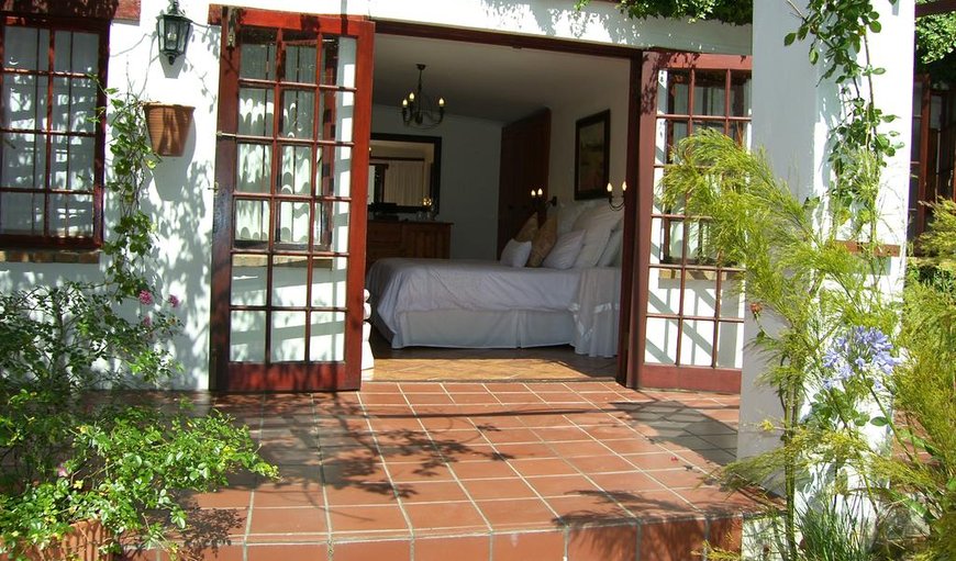 Exclusive and private, wake up to the silence of a beautifully lush garden, viewed through cottage pane French doors