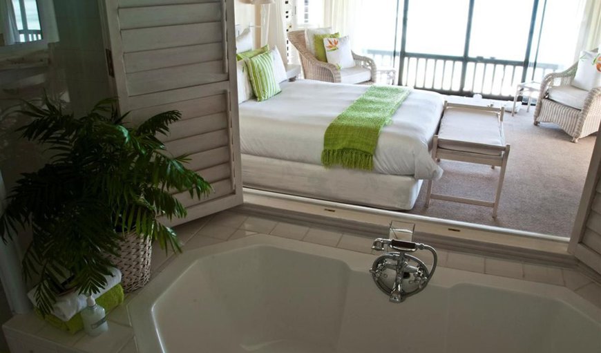 House: Bedroom en-suit with a bath tub