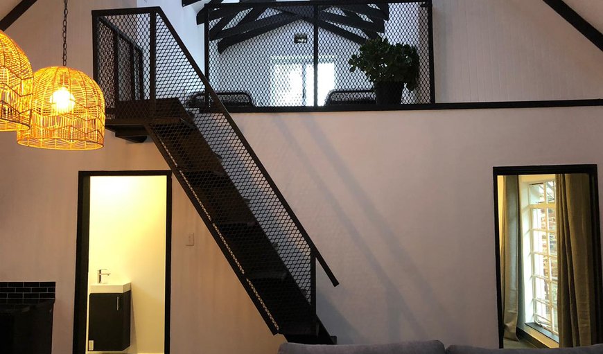 Wynland living area & stair way to loft
