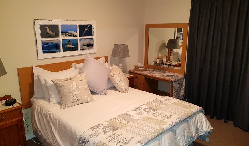 Harbour Lights Port Owen: The main bedroom has a double bed, a TV and an en-suite bathroom fitted with a shower, toilet and basin