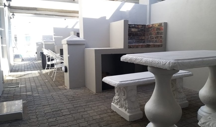Outdoor braai area with seating in Struisbaai, Western Cape, South Africa