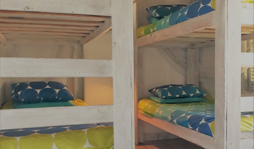 10 Sleeper House: The third bedroom contains two sets of bunk beds.