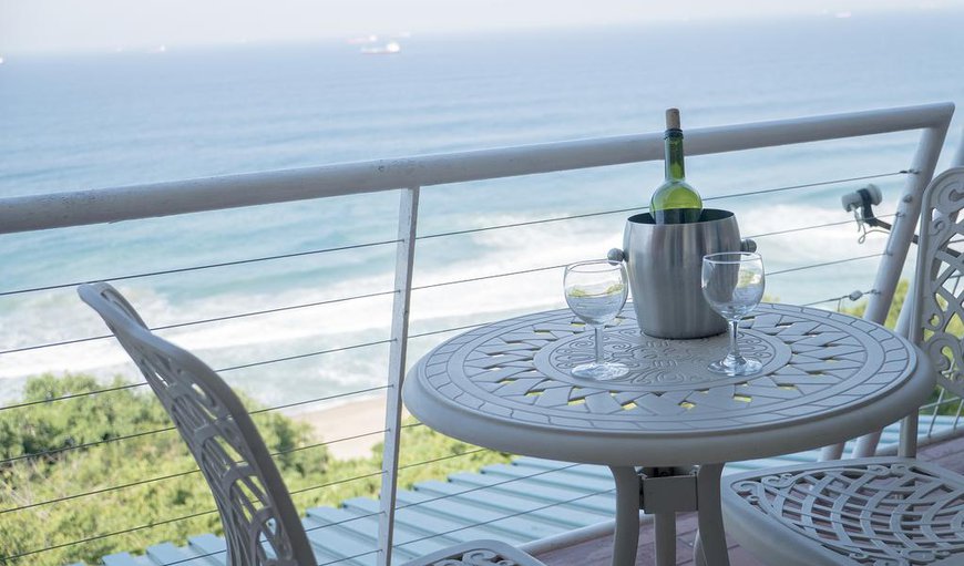 Guests can relax by the outdoor dining area on the balcony and enjoy the spectacular views.