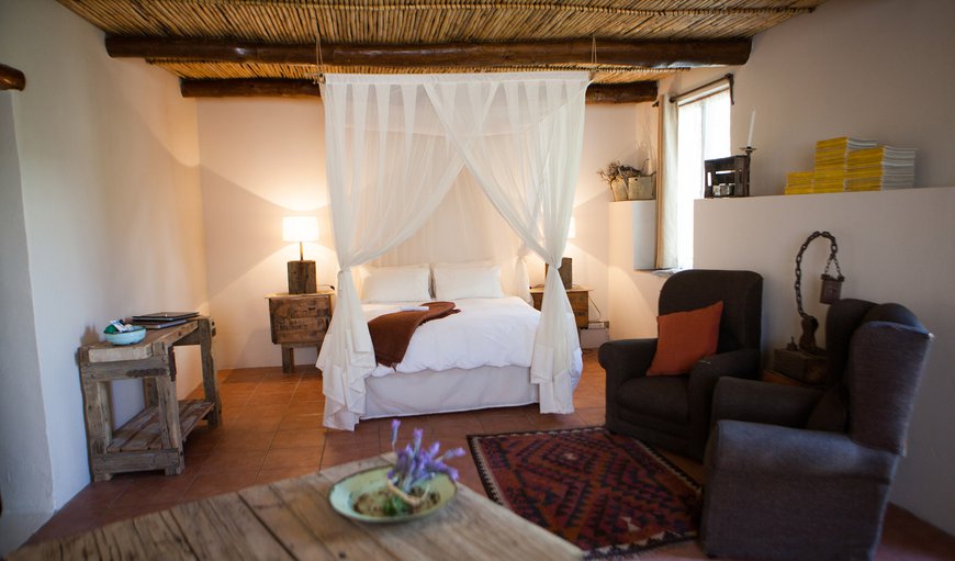 Four poster elegance, with rustic Karoo touches. This image is taken from the kitchonette.