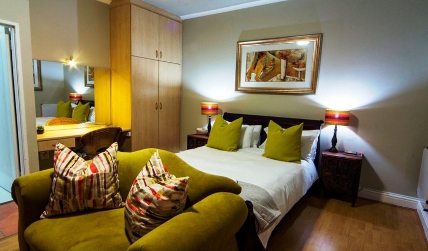 Standard Suite: Standard Suite - Bedroom with a queen size bed