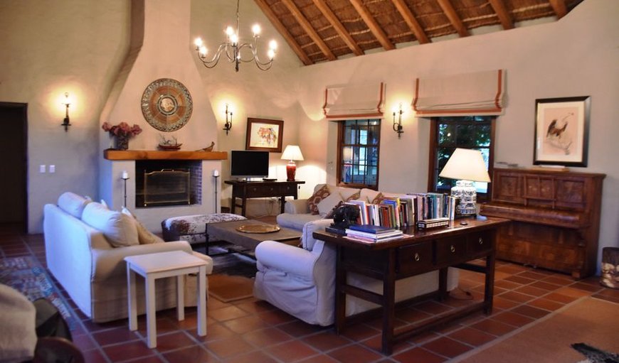 Reiersvlei Farm lounge with fireplace in Stanford, Western Cape, South Africa
