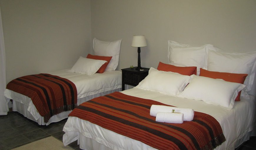 Orange / Family / Pool View: Triple Room - Bedroom with a queen size bed and a single bed