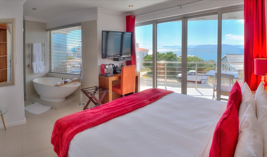 Bayview Room: Bay View Room- The comfortably appointed Bay View Room offers views of the Atlantic Ocean and the Hermanus skyline. Elegantly furnished with lounge chair and coffee table, a king-size bed as well as a business desk.